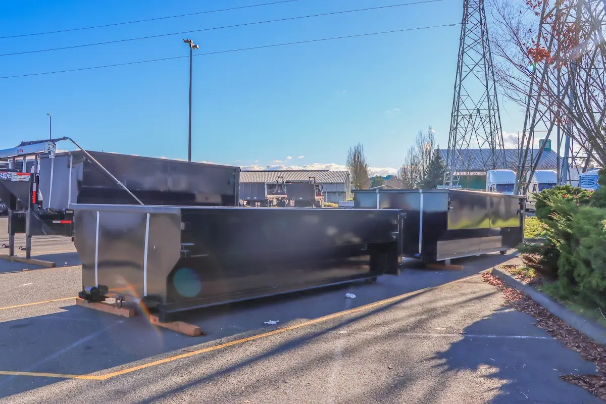 Roll-off dumpster ready for waste disposal at job site for Commercial Dumpster Rental in Grass Lake